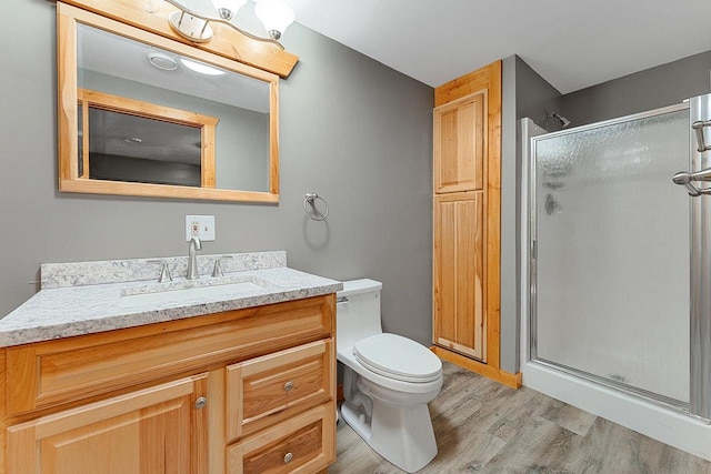 E7498 Mill Rd, Spring Green, WI 53588 - full bathroom with wood finished floors, vanity, and a stall shower