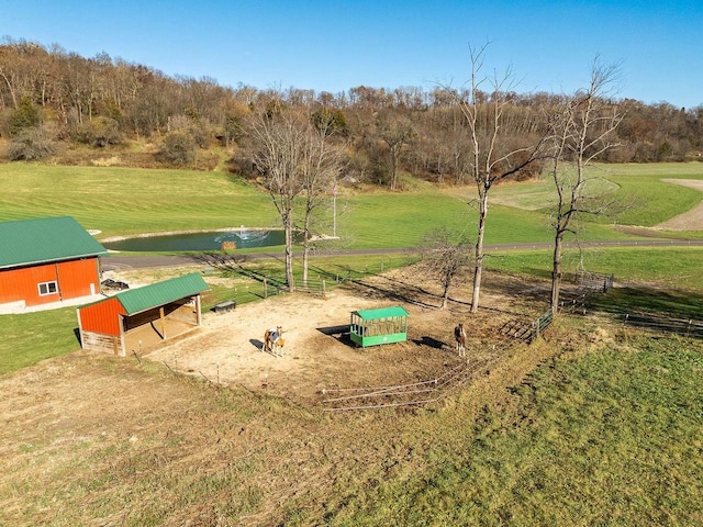 E7498 Mill Rd, Spring Green, WI 53588 - view of property's community with a pole building, an outdoor structure, a water view, and a yard