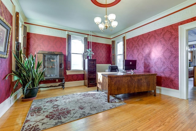 home office featuring a notable chandelier, hardwood / wood-style floors, baseboards, and wallpapered walls