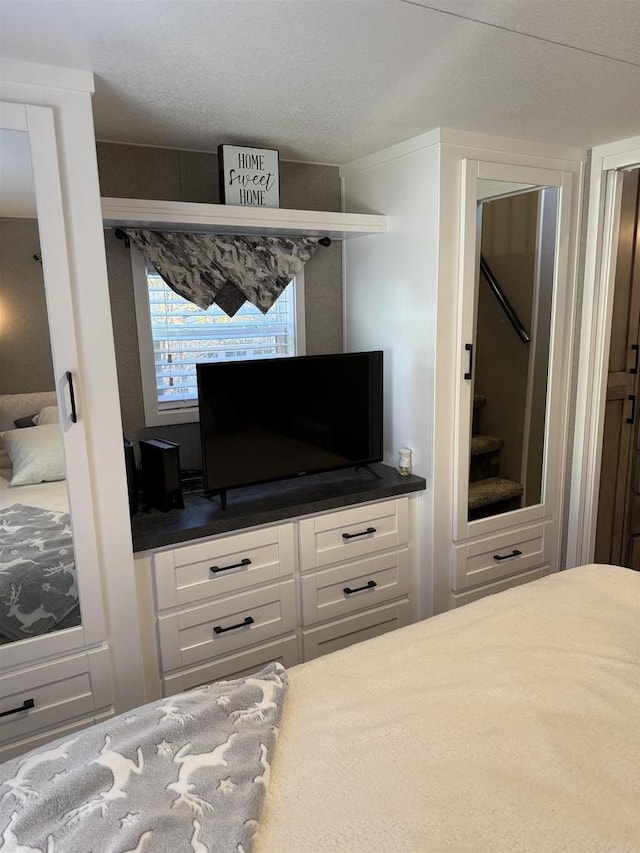 bedroom featuring a textured ceiling