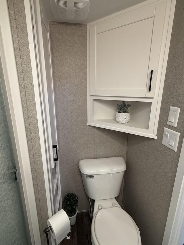 bathroom featuring toilet