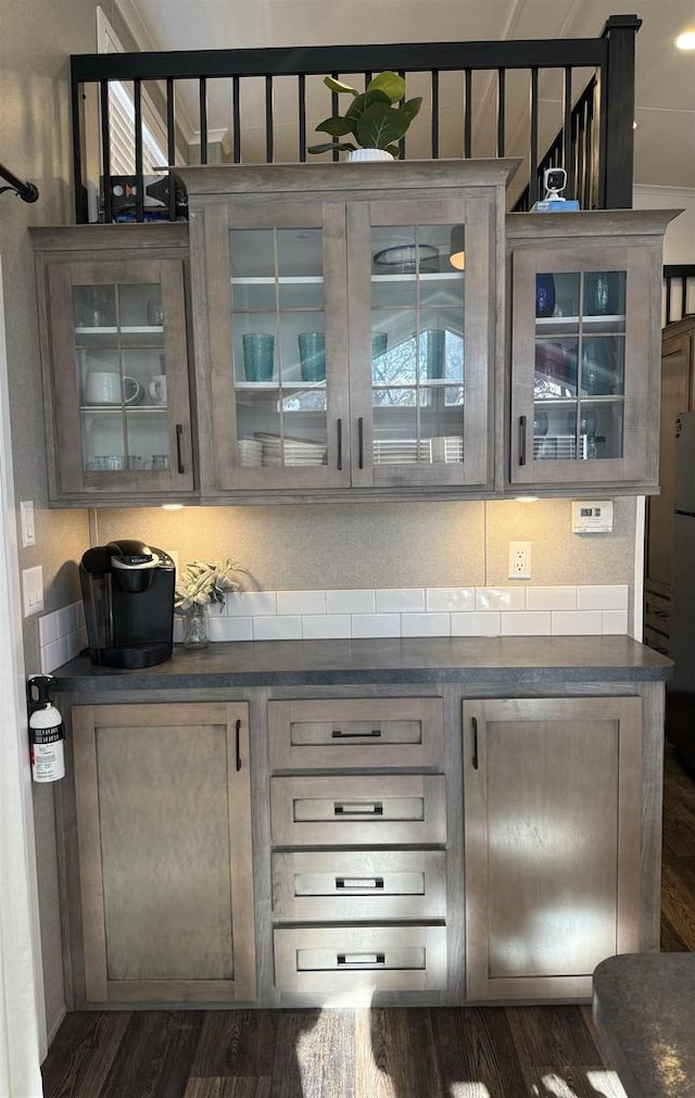 bar with dark hardwood / wood-style floors