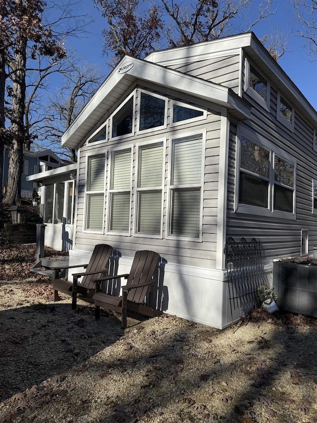 view of side of property with a sunroom