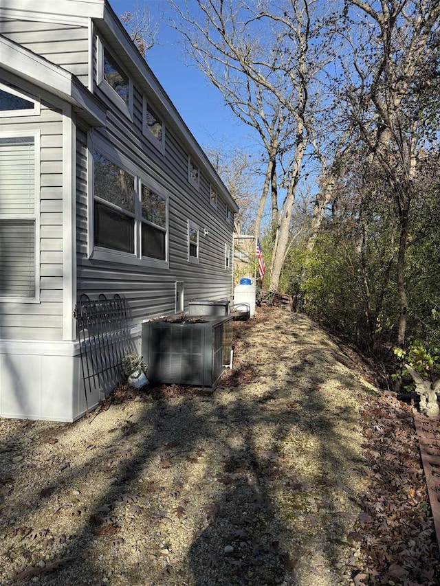 view of side of property with central AC unit