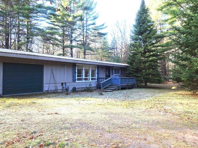 9675 Wayne Dr, Woodruff, WI 54568 - view of front of property with a garage