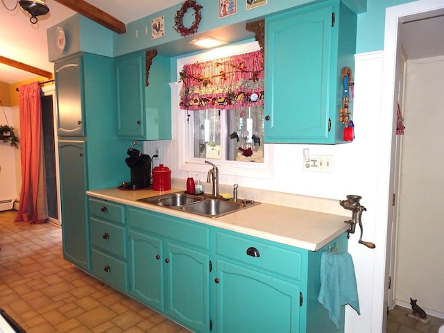 9675 Wayne Dr, Woodruff, WI 54568 - kitchen featuring a sink, light countertops, a baseboard radiator, and brick patterned flooring