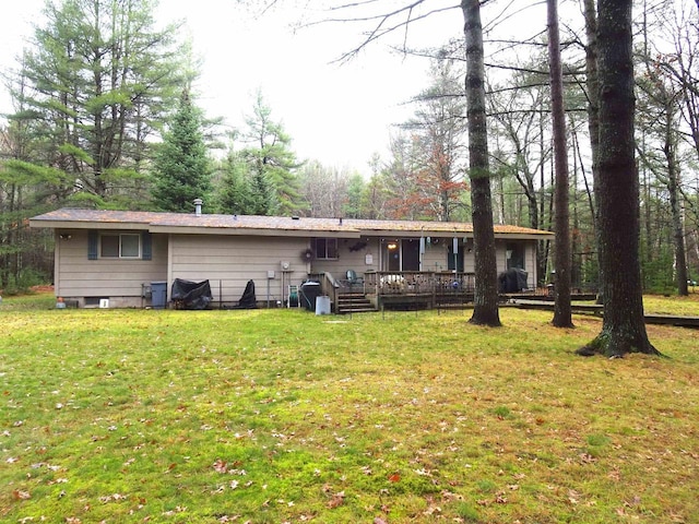 9675 Wayne Dr, Woodruff, WI 54568 - back of property with a deck and a lawn