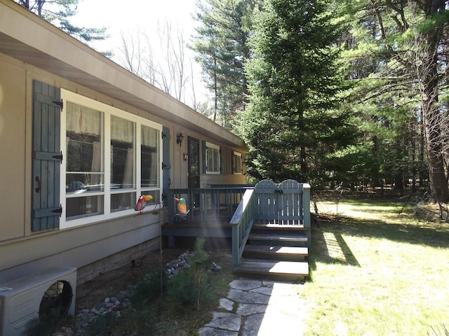 9675 Wayne Dr, Woodruff, WI 54568 - view of grassy yard with a deck