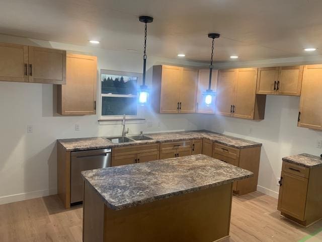 kitchen with sink, stone countertops, decorative light fixtures, dishwasher, and light hardwood / wood-style floors