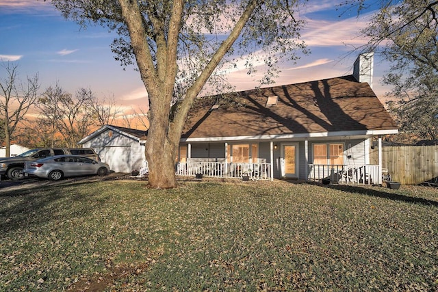 view of front of home with a lawn and covered porch