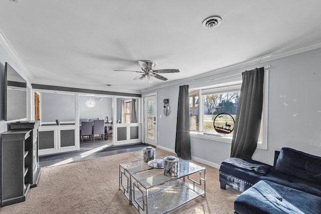 carpeted living room featuring ceiling fan and crown molding