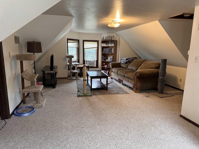 living room featuring cooling unit, vaulted ceiling, and carpet floors