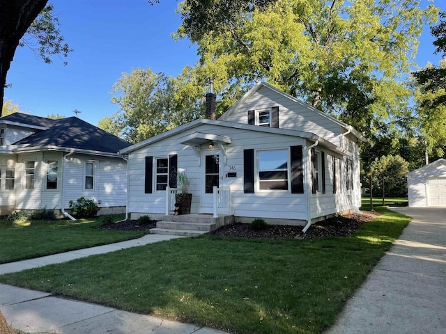 bungalow-style house with a front lawn