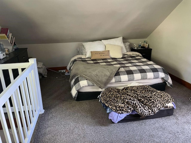 carpeted bedroom with vaulted ceiling