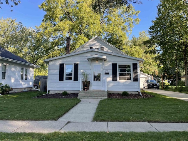 bungalow-style house featuring a front yard