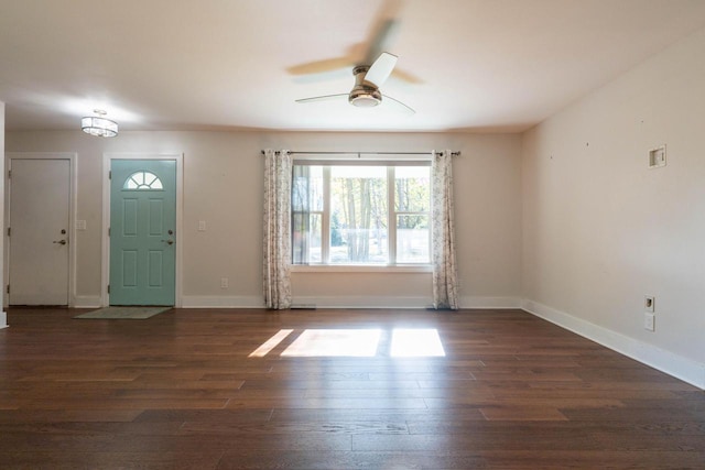 foyer entrance with ceiling fan and dark hardwood / wood-style floors