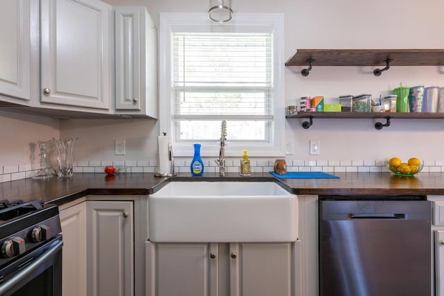 kitchen with white cabinetry, appliances with stainless steel finishes, and sink