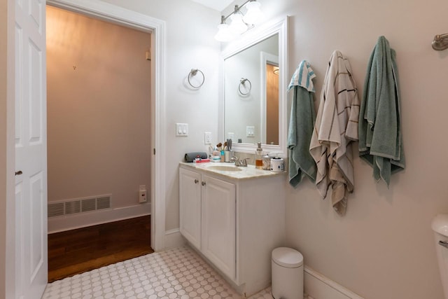 bathroom featuring vanity and hardwood / wood-style flooring