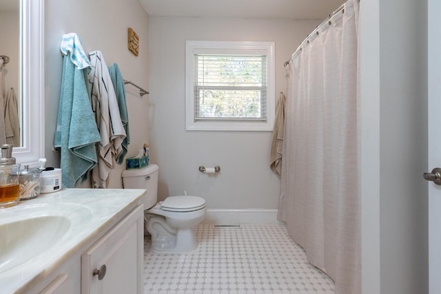 bathroom featuring toilet and vanity