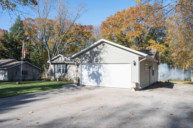 view of front of house with a garage and a front yard