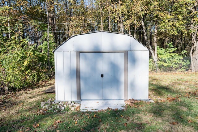 view of outdoor structure with a yard