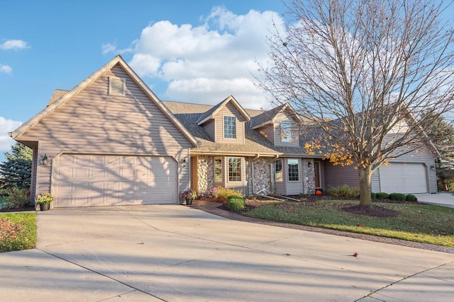 new england style home with a garage