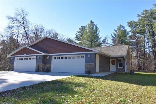 2343 11 1/4 Ave, Cameron, WI 54822 - view of front of home with a garage, stone siding, a front lawn, and driveway
