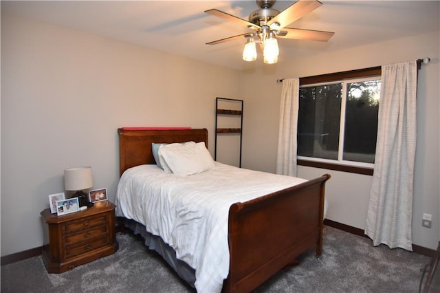 bedroom featuring dark colored carpet and ceiling fan