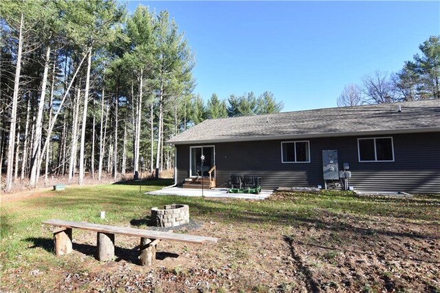 2343 11 1/4 Ave, Cameron, WI 54822 - back of property with entry steps, a yard, and a patio