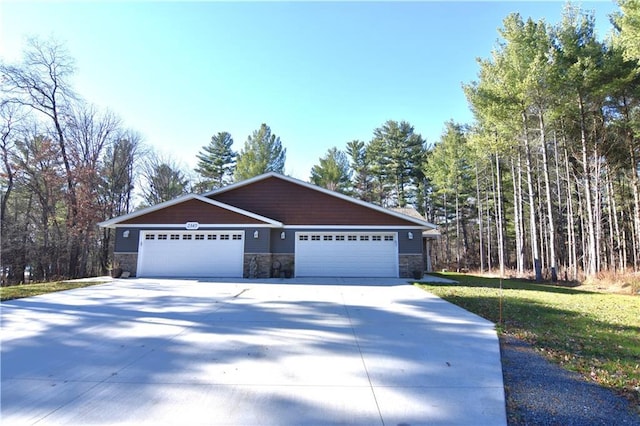 view of front of property with a garage and a front yard