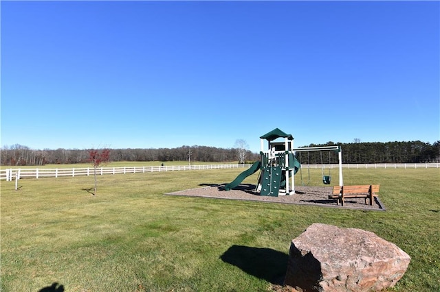 view of play area with a rural view and a yard