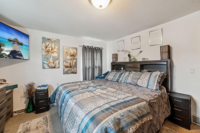 carpeted bedroom featuring a textured ceiling