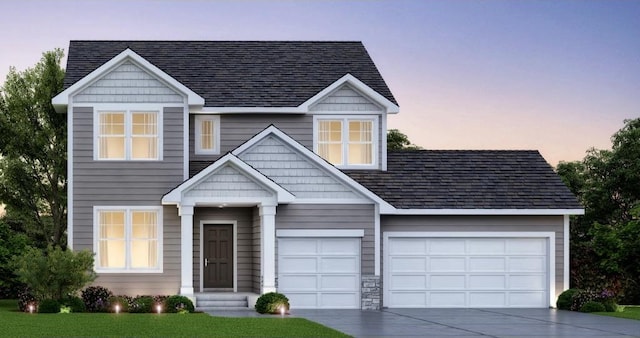 view of front of house with a garage, entry steps, and concrete driveway