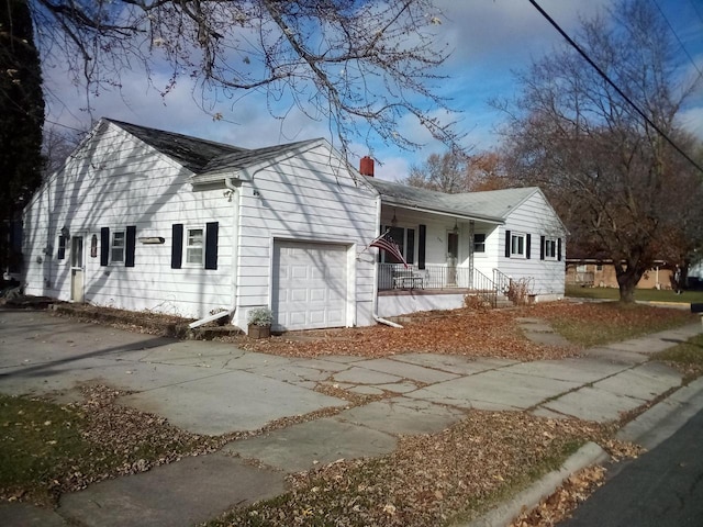 view of front of home with a garage and a porch