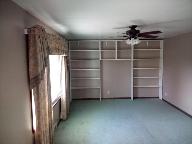 unfurnished bedroom with carpet and ceiling fan