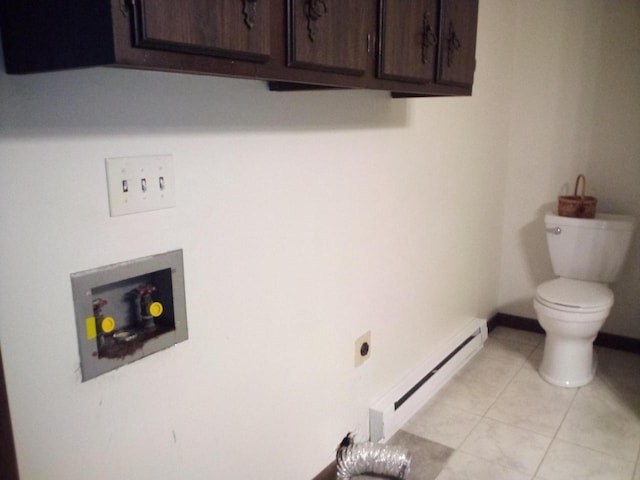 washroom with baseboard heating, electric dryer hookup, and light tile patterned floors