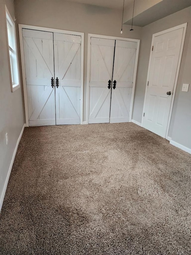 unfurnished bedroom featuring carpet flooring