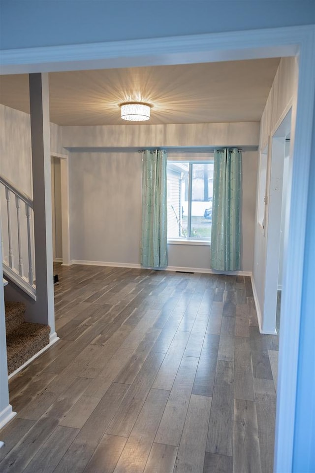 empty room with dark hardwood / wood-style floors