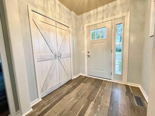 entryway with dark hardwood / wood-style floors