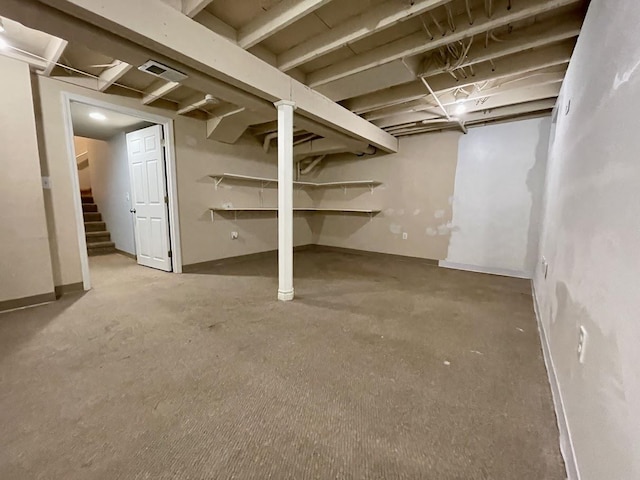 basement featuring carpet flooring