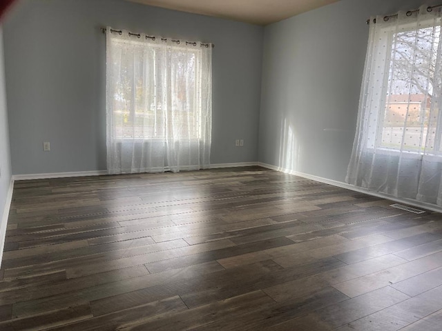 unfurnished room featuring dark hardwood / wood-style floors