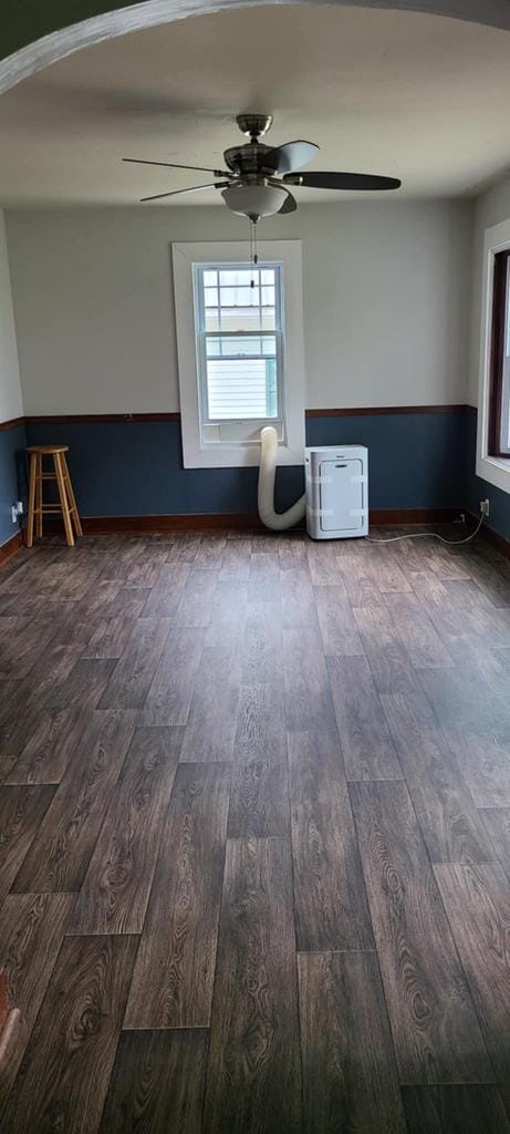 unfurnished room with hardwood / wood-style floors and ceiling fan