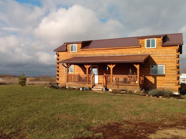 log-style house featuring a porch and a front lawn