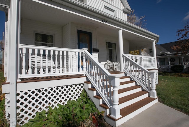 entrance to property with a porch