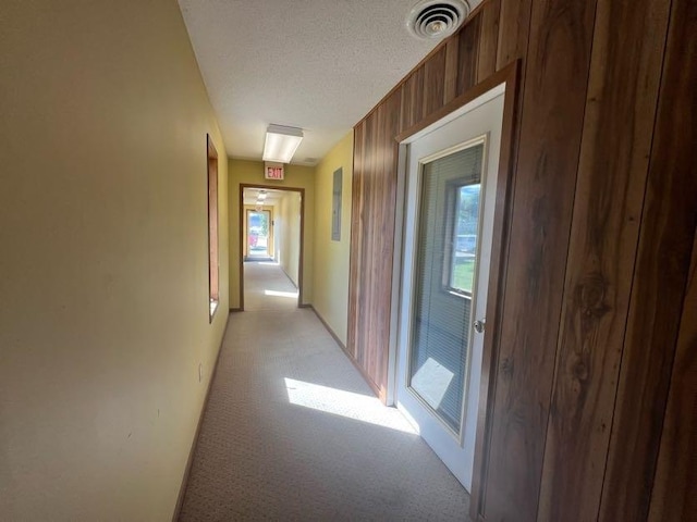 1802 Talen St, Menomonie, WI 54751 - hall featuring light carpet and a textured ceiling
