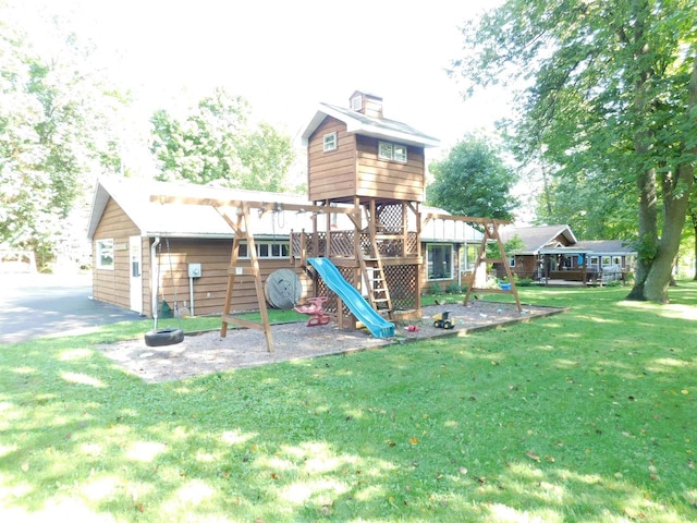 view of playground with a yard