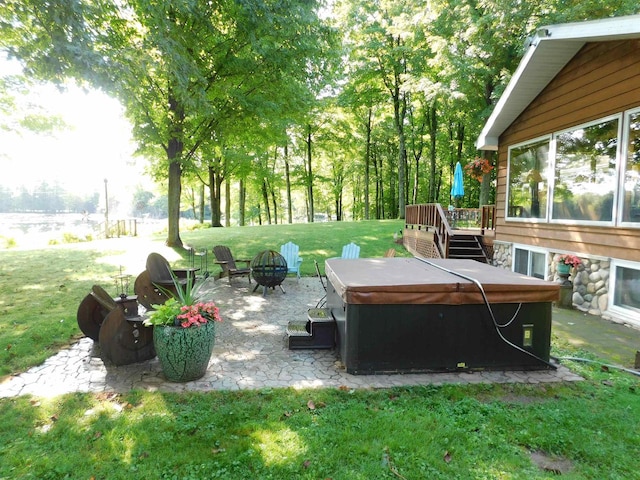 view of yard featuring a patio and a wooden deck