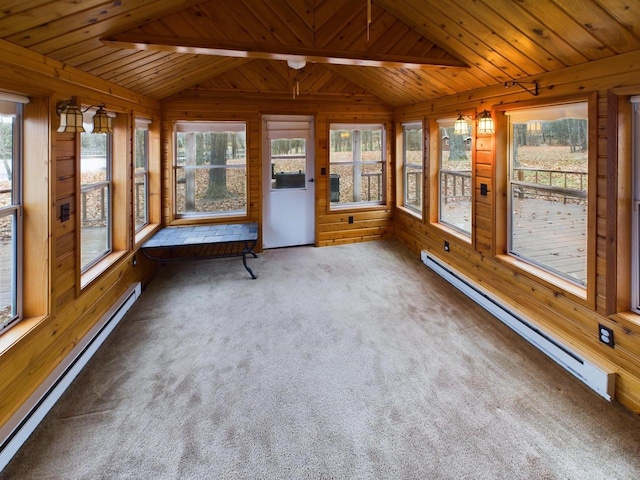 unfurnished sunroom with a baseboard heating unit and a healthy amount of sunlight