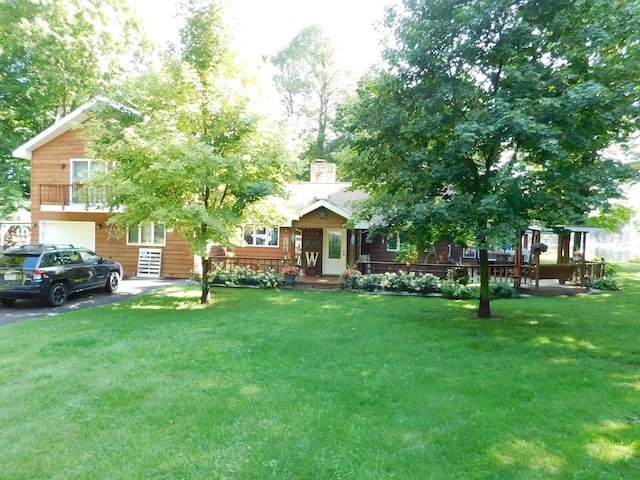 view of front of house with a front lawn and a garage