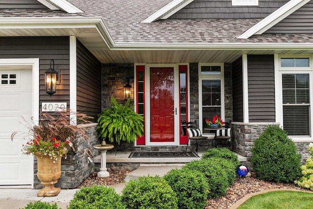 view of exterior entry with covered porch